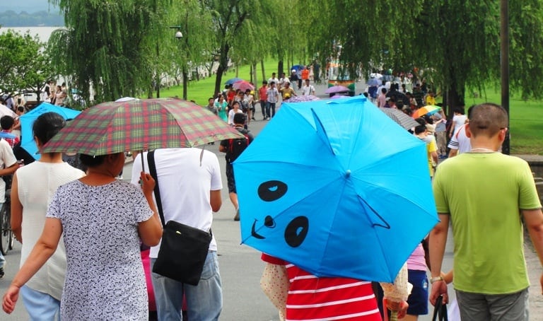 chinese habits: umbrellas on a sunny day